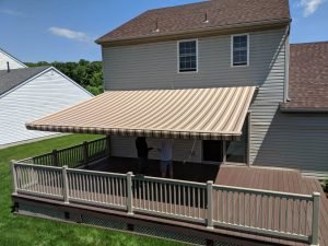 Two People Under Awning